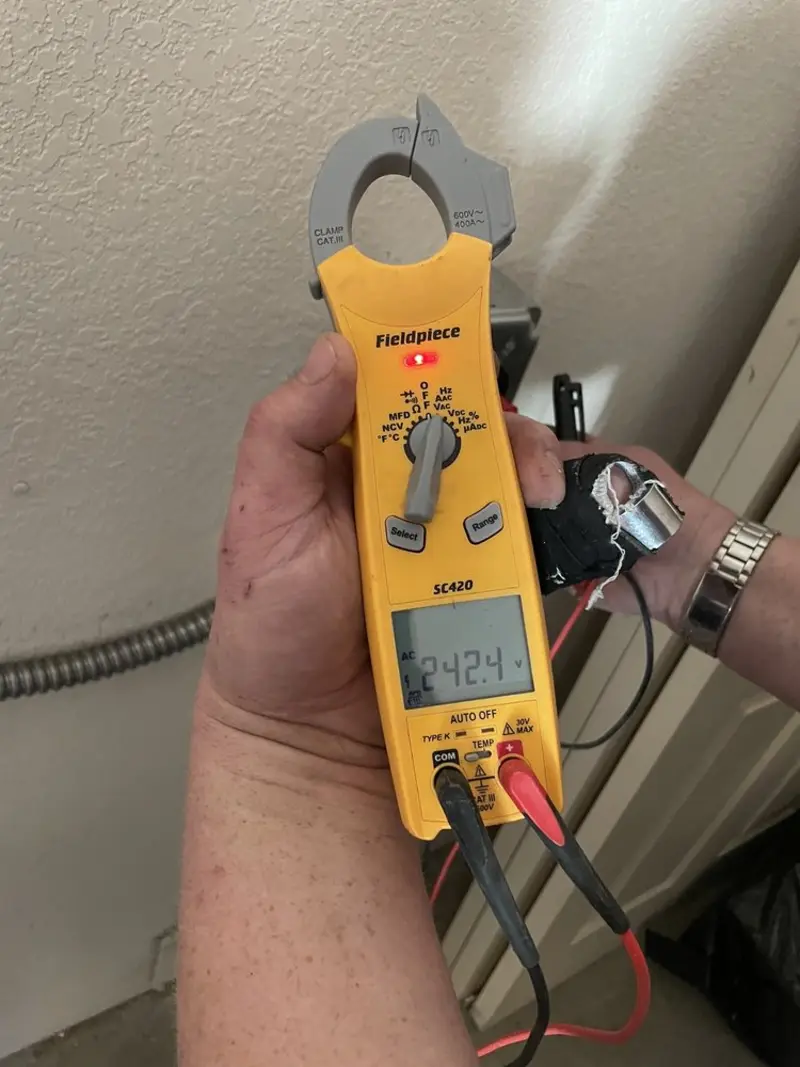 Voltage testing with clamp meter during Electrical Installation Services in East Windsor